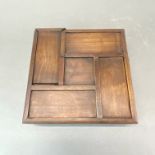 A Chinese wooden puzzle box, 20 x 20 x 6cm.