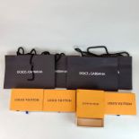 A group of designer boxes and bags.