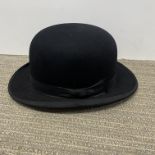 A vintage Dunn & Co. gentlemans bowler hat.
