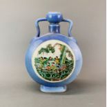 A large Chinese porcelain moon vase enamelled with scenes of a boat race, H. 35cm.