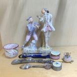 Two porcelain figurines and a group of other items.