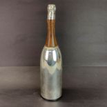 A wood and silver plated metal champagne bottle cocktail shaker, H. 38cm.
