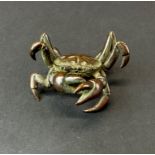 A Japanese bronze figure of a crab, H. 3cm. W. 6cm.