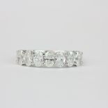 An 18ct white gold half eternity ring set with oval cut diamonds, approx 1.37ct. with carat weight
