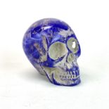 An unusual moulded resin skull, H. 10cm.