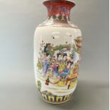 A large Chinese enamelled porcelain vase decorated with ladies in a garden playing games, H. 58cm.