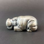 A Russian stamped 88 silver hippopotamus with ruby eyes, L. 8cm.