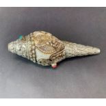 A Tibetan white metal mounted conch shell horn, L. 18cm.