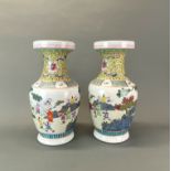 A pair of Chinese hand enamelled porcelain vases, H. 41cm.