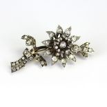 An 18ct yellow gold and silver trembleuse brooch set with diamonds, approx 3.5ct. L. 5cm