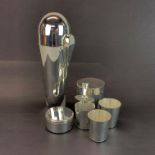 A rocket style silver-plated cocktail shaker with flasks, measures etc. H. 24cm.