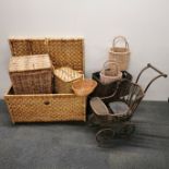 A vintage wicker hamper together with a wicker dolls pram and a group of wicker baskets etc.