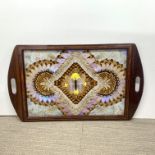 An Edwardian magohogany tray inset with butterfly wings, 39 x 66cm.