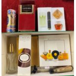 A collection of boxed perfume miniatures.
