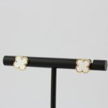 A pair of 18ct yellow gold and mother of pearl clover stud earrings, L. 0.7cm. Matching to lot 102.