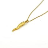 A 9ct yellow gold Horn of plenty pendant, L. 3.5cm. on a 9ct yellow gold chain.