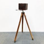 A box camera on tri-pod, camera size 18 x 12 x 14cm.