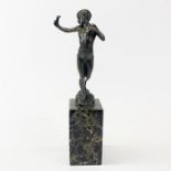 A small bronze figure of a boy with a catapult on a marble base, H. 32 cm.