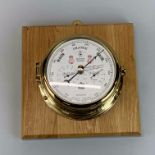 An S.E.Wills ship's style wall mounted barometer, matching lot 322, mount size 25 x 25cm.