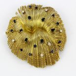 A large 18ct yellow gold (tested) brooch set with marquise and round cut sapphires and diamonds,