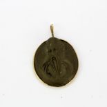 An 18ct yellow gold (tested) mounted lava cameo pendant, L. 3.5cm.