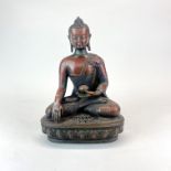 A Tibetan bronze figure of a seated Buddha, H. 30cm.