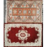 A Turkish ground hand woven wool rug, 80 x 143cm. together with a red ground rug, 801 x 150cm.