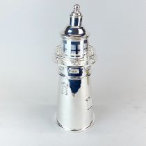 An impressive silver plated lighthouse cocktail shaker, H. 35cm.