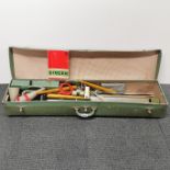 A vintage Singer knitting machine in original case and instructions, case L. 108cm.