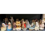 A quantity of musical figurines with a box of further musical figurines.