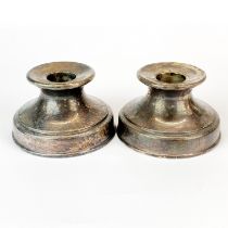 A pair of chunky sterling silver candlesticks, Dia. 8.5cm, H. 5cm.