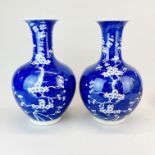 A pair of Chinese prunus pattern porcelain vases, H. 36cm.