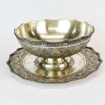 A heavy Eastern .84 silver bowl and tray. Bowl Dia. 23cm, H. 12cm, tray dia. 29cm.