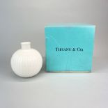 A boxed Tiffany & Co porcelain round bud vase, H. 13cm.