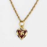 A high carat (tested minimum 18ct) yellow gold and enamelled Hindu peace symbol pendant on a 9ct