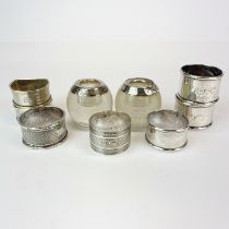 Two silver mounted match strikers and a group of hallmarked silver napkin rings.