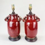 A superb pair of Chinese sang de boeuf glazed stoneware vases mounted as lamp bases. Slightly A/F,