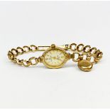 A lady's 9ct gold sovereign wristwatch and bracelet.