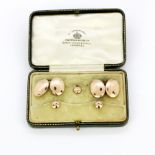 A boxed hallmarked 9ct rose gold Mappin & Webb dress set consisting of a pair of cufflinks and three