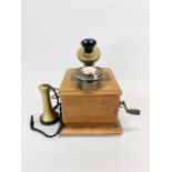 An early wall-mounted telephone.