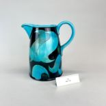 Jane Cox; A contemporary studio pottery jug 'Aquitaine' H. 21.cm. With aluminium exhibition label.