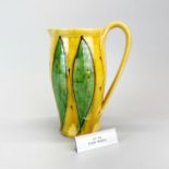 Fenella Mallalieu; A contemporary signed studio pottery jug, H. 24cm. With aluminium exhibition