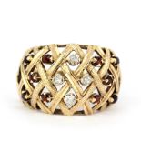 A large yellow metal (tested minimum 9ct gold) woven style ring set with rose cut diamonds and