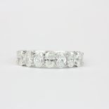 An 18ct white gold half eternity ring set with oval cut diamonds, approx. 1.37ct. with carat