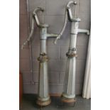 A pair of heavy vintage cast iron 'Terpo' water pumps, H. 159cm.