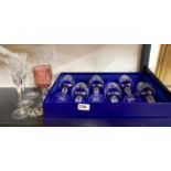 A pair of Waterford crystal wine glasses with a group of further glassware.