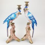 A pair of large continental ormolu mounted porcelain parrot candlesticks, tallest H. 52cm