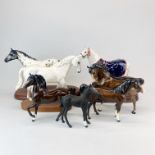 A group of Beswick and Royal Doulton horse figures.