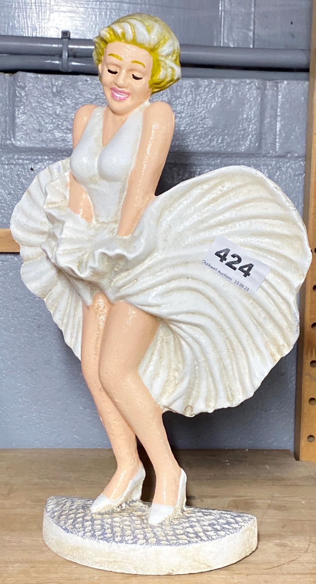 A painted cast iron Marilyn Monroe doorstop.