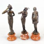 A group of three Art Nouveau style bronze figures on marble bases, tallest H. 23cm.